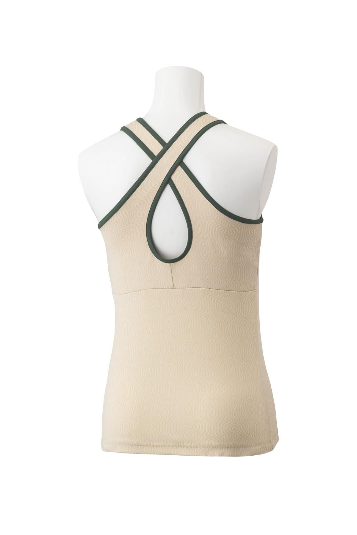 The mannequin is showcasing the Yonex 20757 Women's Tennis Tank Top in sand, featuring dark green trim and crafted from Xylitol for a cooling effect. This high-performance garment includes a cross-back design with a keyhole opening to enhance comfort during tournaments.