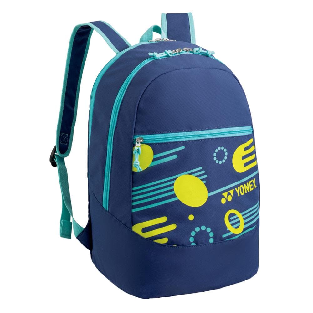The Yonex 22412EX Junior Backpack in navy blue features vibrant yellow and turquoise geometric designs. It offers adjustable padded shoulder straps for comfort, along with a front zippered pocket and a spacious main compartment.