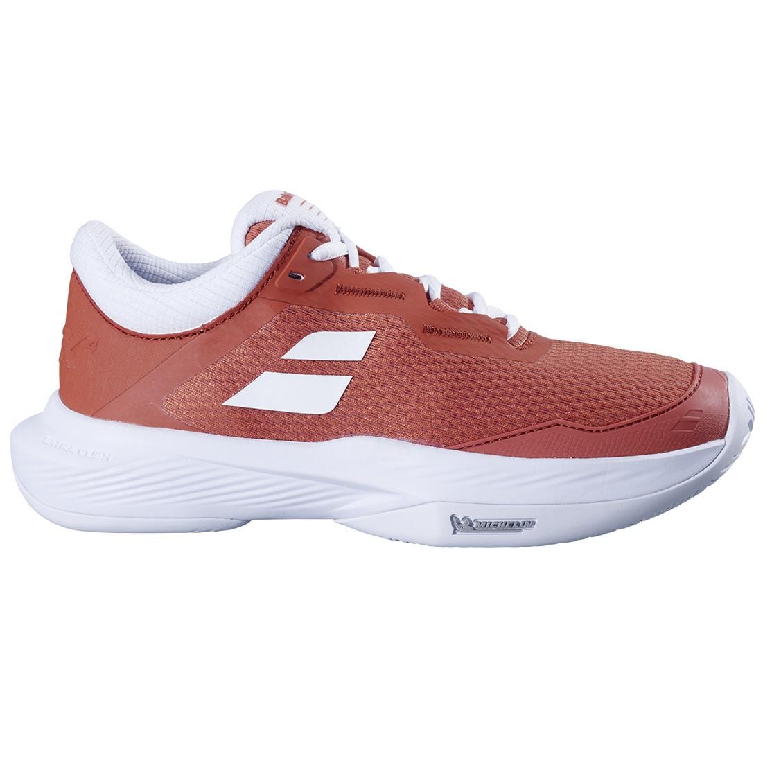 The Babolat SFX 4 Women's Tennis Shoes in Terra Cotta feature white laces, inner lining, and sole, with two white diagonal side stripes. Inspired by the comfort of the Babolat SFX 4 All Court.