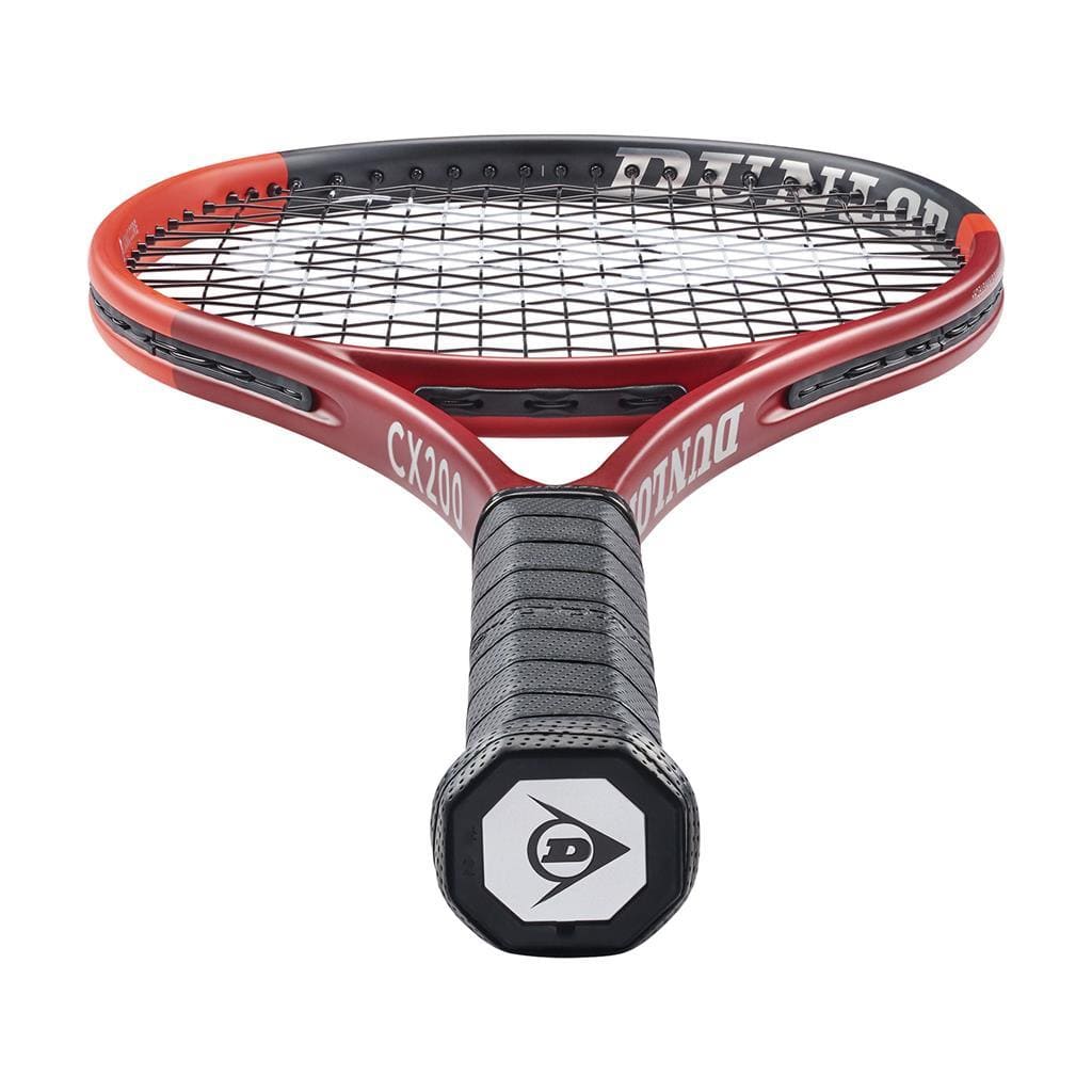 Close-up of a Dunlop CX 200 2024 Tennis Racket, showcasing a red frame with tightly strung black strings for enhanced spin potential. The grip features the iconic "D" logo at the end, and the racket is angled slightly upward.