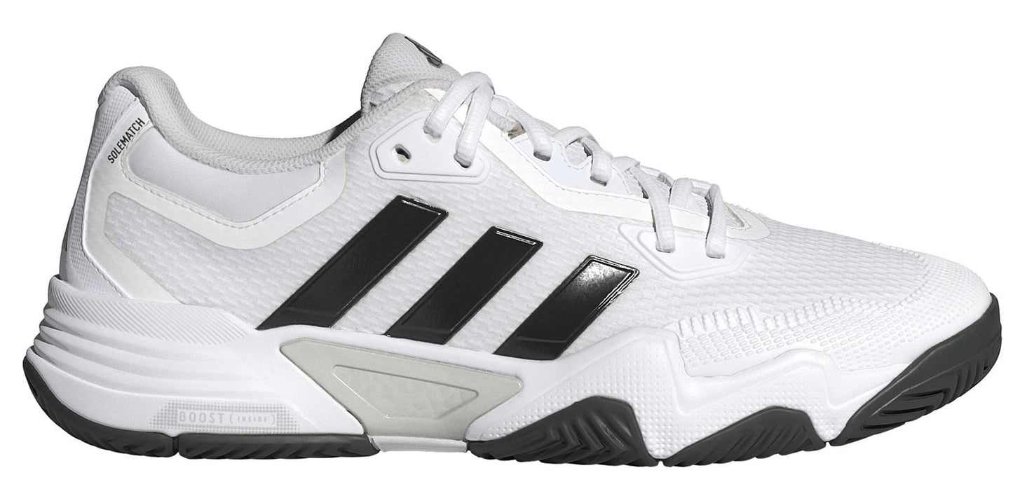 The ADIDAS Solematch Control 2 Men's Tennis Shoes by adidas feature black stripes on a white design, textured sole, branded heel label, and a midsole enhanced with ADIDAS BOOST cushioning for exceptional support and comfort.