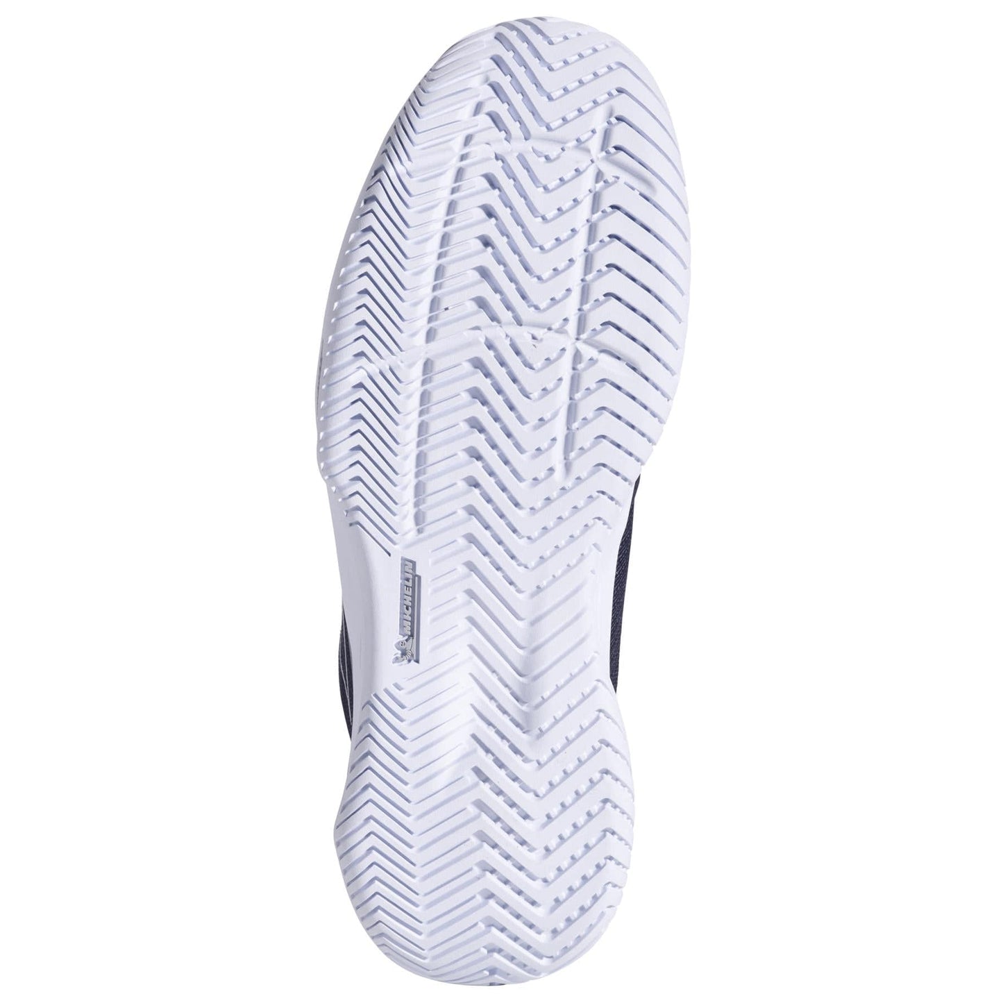 The image shows the sole of a Babolat SFX EVO All Court 2025 Women's Tennis Shoe in black and silver, featuring a white textured pattern with angled lines for traction and durability. A small rectangular Babolat logo is centered elegantly, highlighting style and comfort.