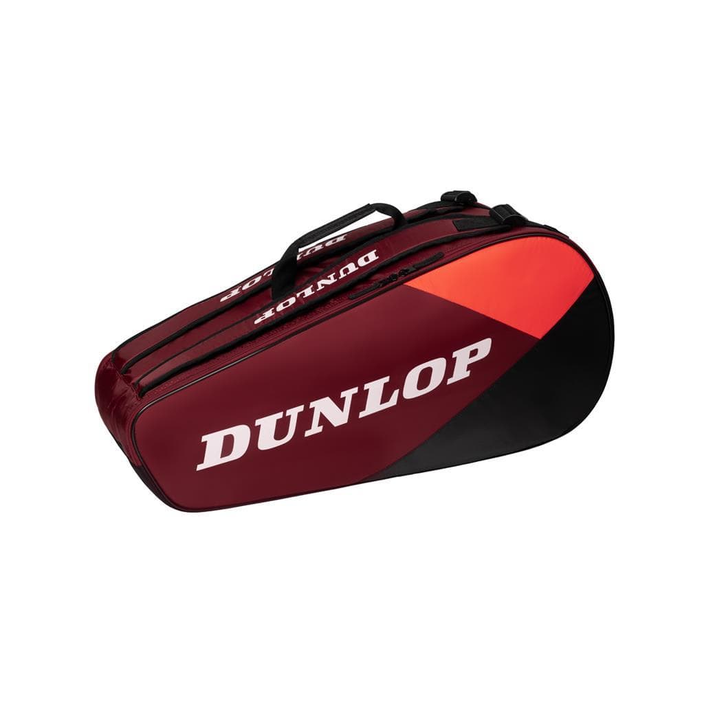 The Dunlop CX Club 6 Tennis Racket Bag in black and red showcases a prominent white logo on the side. This roomy bag is perfect for your tennis gear, featuring a zip closure and a convenient top handle.