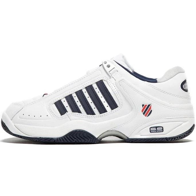 The K-Swiss Defier RS Men's Tennis Shoes in White, Dress Blue, and Fiery Red are designed for stability on the court. They feature dress blue stripes and a small logo on the side. For enhanced breathability, they include perforations, while a textured sole offers excellent grip. The heel is equipped with a durable, raised circular patch displaying another logo to ensure lasting performance.