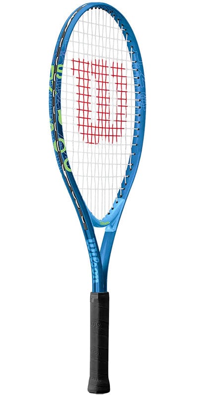 A Wilson US Open 25 Junior Tennis Racket, featuring its iconic blue color with a black handle, stands upright. The strings create a grid pattern with a red "W" centered in the middle. Constructed with an AirLite frame, this racket is ideal for young players looking for USTA support in their game.