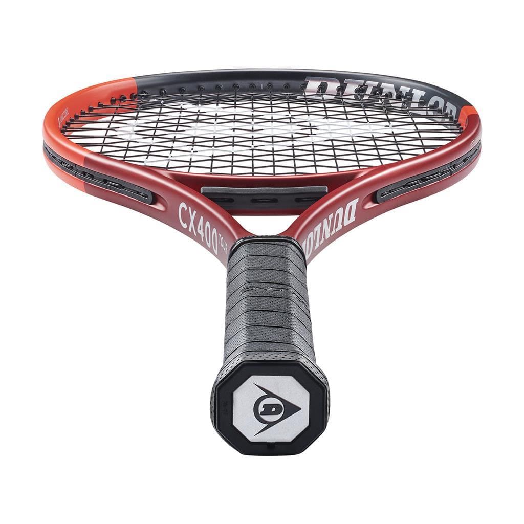 Close-up view of the Dunlop CX 400 Tour 2024 Tennis Racket - Red, showcasing its improved racket feel. The handle and stringed head prominently feature the branding on the frame. Its textured black grip with a hexagonal logo at the base highlights its spin potential as the racket is presented at an upward angle.
