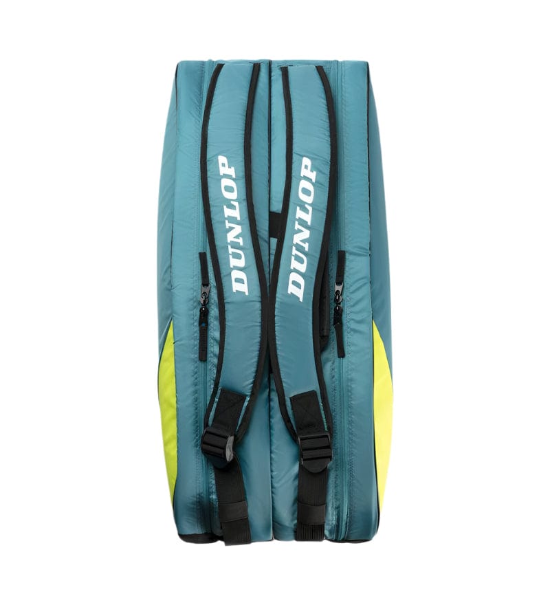 The Dunlop SX Club 10 Racket Tennis Bag is displayed from the back, showcasing its teal/black/yellow design with two black padded straps featuring "Dunlop" in white. Spacious compartments and side zippers make this bag stand out against a plain white background.