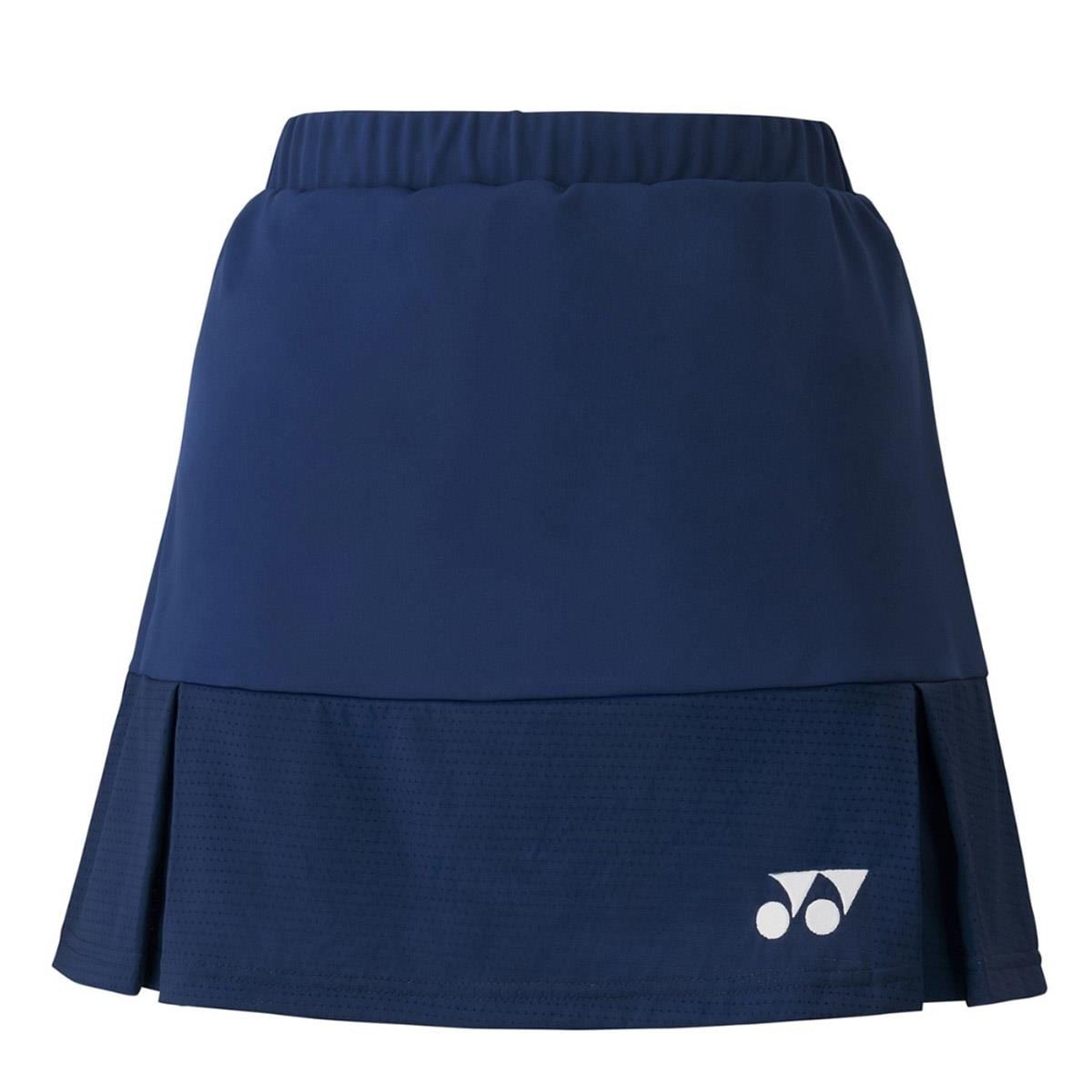 Introducing the Yonex 26064 Women's Skirt in Midnight Navy, featuring a layered design and an elastic waistband perfect for the court. This skirt showcases a white logo on the lower right corner and is crafted with smooth, lightweight, and breathable materials ideal for sports activities.