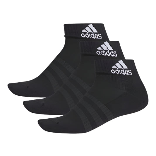 Three pairs of adidas Cushion Ankle Socks 3PP Black, each featuring arch support and white Adidas logos on the cuffs, are displayed side by side on a light gray background.