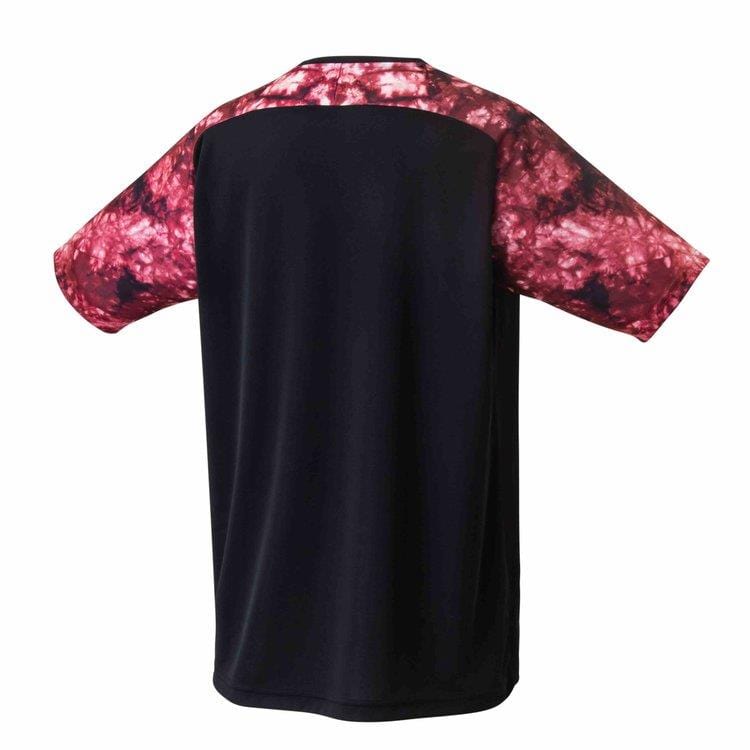 The Yonex 16572 Men's T-Shirt in black showcases a striking red and white tie-dye pattern on the sleeves and shoulders when viewed from the back. Made with quick-dry fabric, it ensures excellent sweat absorption and comfort for any activity.