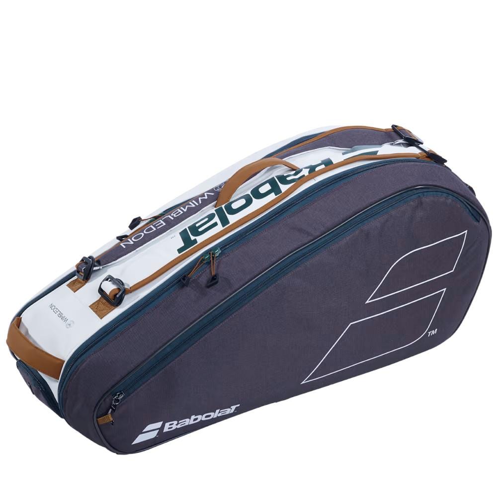 The Babolat RH6 Pure Wimbledon 6 Racket Tennis Bag in White and Grey features a stylish design with multiple compartments, including an insulated section. It also comes with zippers and straps for convenient carrying. The Babolat logo is prominently displayed, making it ideal for any Wimbledon fan or tennis enthusiast.