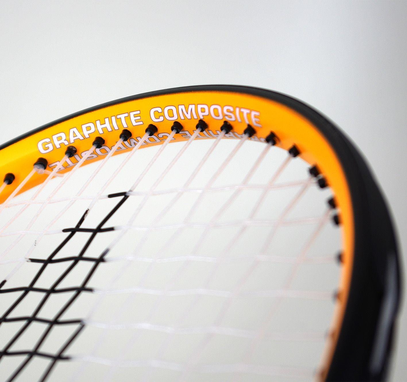 Close-up of the Karakal Pro Composite 26 Junior Tennis Racket head showcasing a sleek yellow rim, black edge, and white strings. The words "Graphite Composite" suggest its improved power control features.