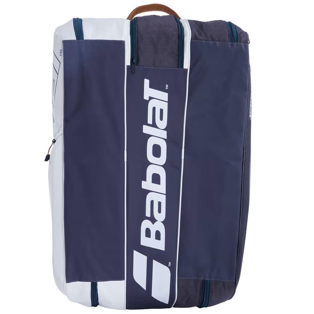 The Babolat RH12 Pure Wimbledon 12 Racket Tennis Bag, perfect for tennis enthusiasts, features a spacious design in white and grey with the distinctive Babolat logo. It offers multiple zippered compartments and a practical top handle for easy carrying.
