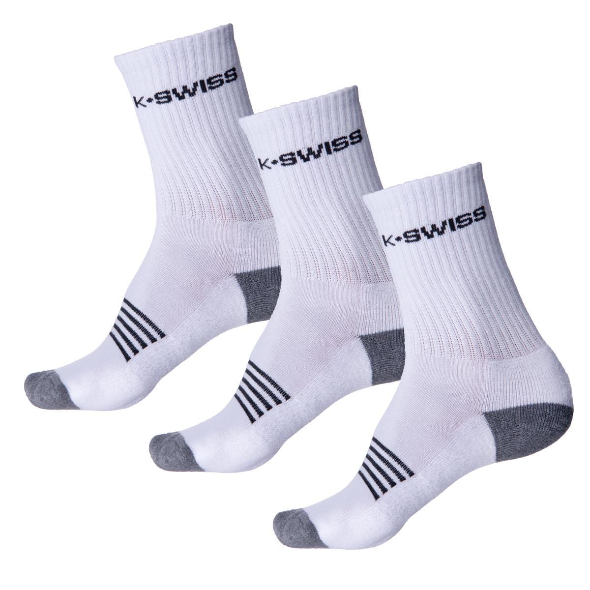 The K-Swiss Crew Sport Socks (3 Pack) - White are showcased, featuring white crew socks with gray heels and toes. Each pair is adorned with black stripes on the sole and the iconic K-Swiss logo on the cuff, and boasts advanced moisture absorption qualities. The socks are neatly displayed in a row against a white background.