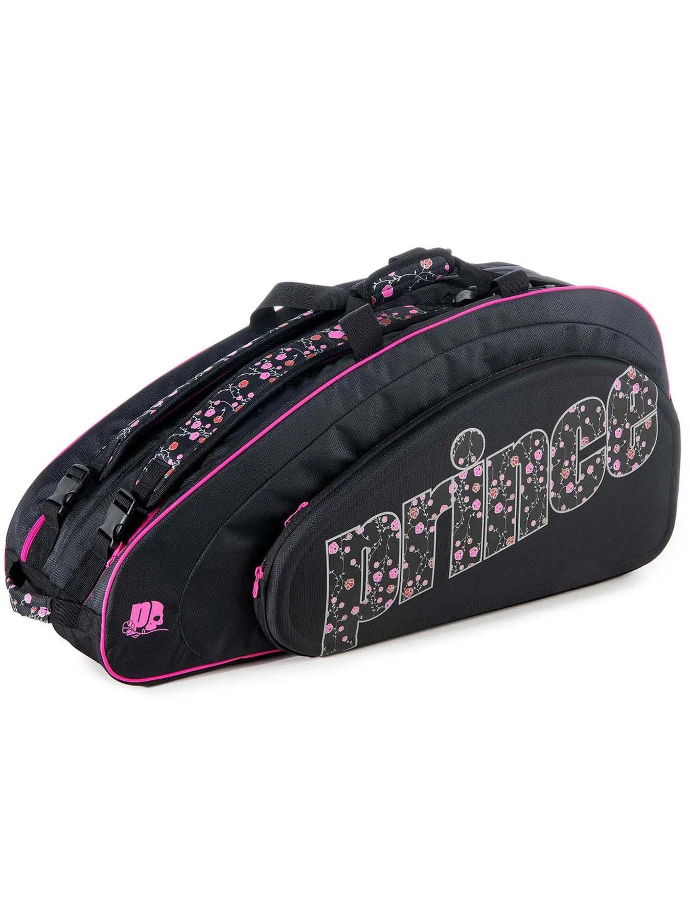 The Prince Hydrogen Lady Mary 6 Racket Tennis Bag in Black and Pink showcases a chic design with pink accents and floral patterns. Its roomy interior accommodates up to six rackets, while the brand name "Prince" is prominently displayed in large white letters on the side, offering both functionality and style.