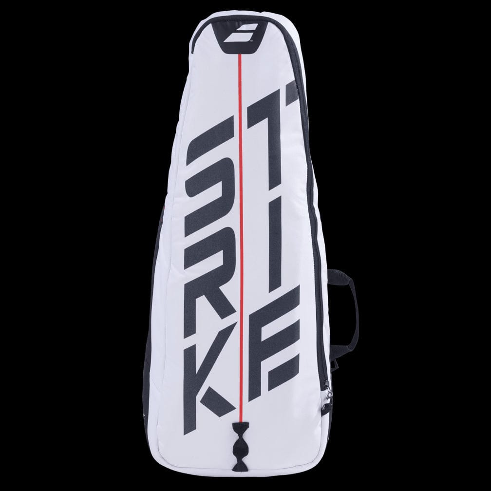 The Babolat Pure Strike Tennis Backpack - White / Red is a stylish tennis racket bag featuring bold black and red lettering on the front, ideal for carrying your tennis essentials. This backpack includes a convenient side handle, a bottom zipper, and an isothermal insulated compartment. The background of this sleek design is black.