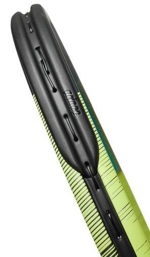 Close-up of a green and black bicycle tire with a tread design, featuring a textured pattern and smooth sidewalls. The name "Prince" is visible on the side, echoing the precision of the Prince Warrior 100 300g Tennis Racket, combined with horizontal lines and geometric shapes.