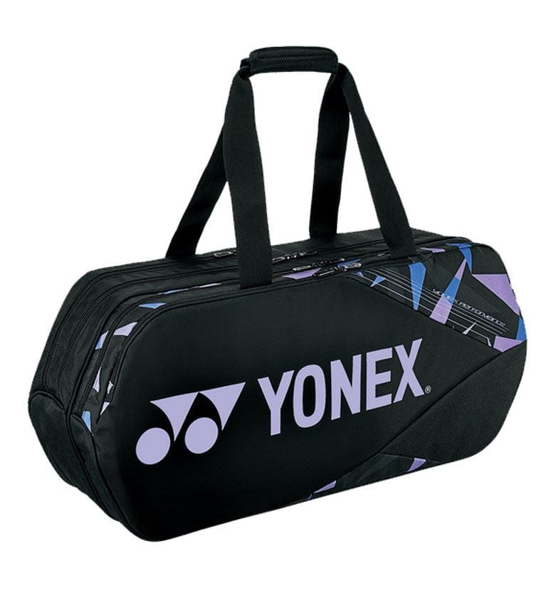 The Yonex 92231WEX Pro Tournament Bag in Mist Purple is a stylish sports bag with purple and blue accents. It offers professional-level quality, featuring dual handles for easy portability and a roomy central compartment. The distinctive Yonex logo adds the finishing touch to this tournament-inspired design.