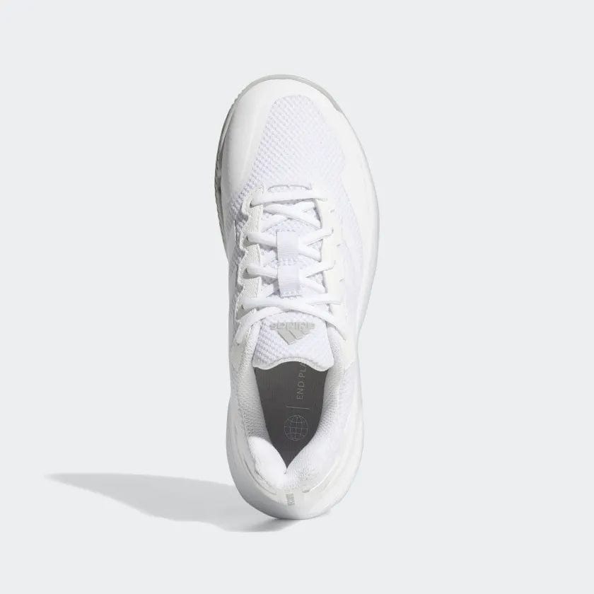 Top view of a single white adidas GameCourt 2 Women’s Tennis Shoe with a mesh upper and white laces on a light gray background. The shoe from adidas showcases a sleek, modern design, featuring a hard court outsole and a subtle logo on the tongue.