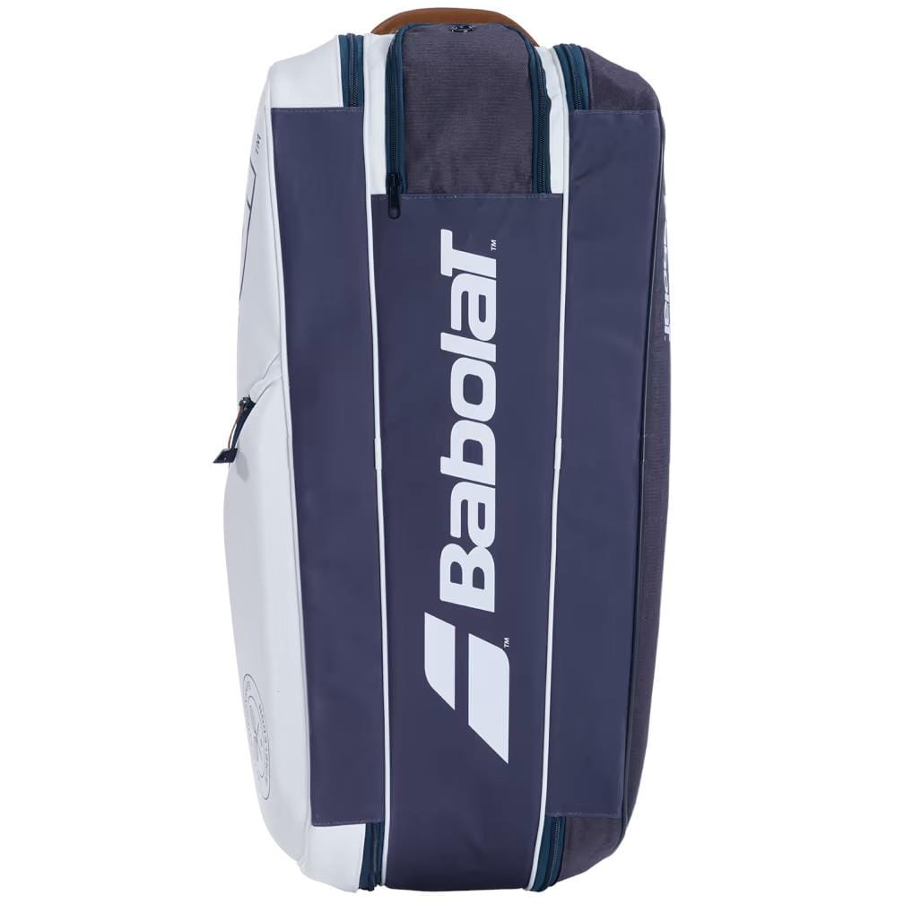 The Babolat RH6 Pure Wimbledon 6 Racket Tennis Bag in white and grey stands upright, showcasing the logo prominently at the center. Its sleek, modern design features zippered compartments on the sides, including an insulated compartment perfect for keeping gear protected during Wimbledon matches.