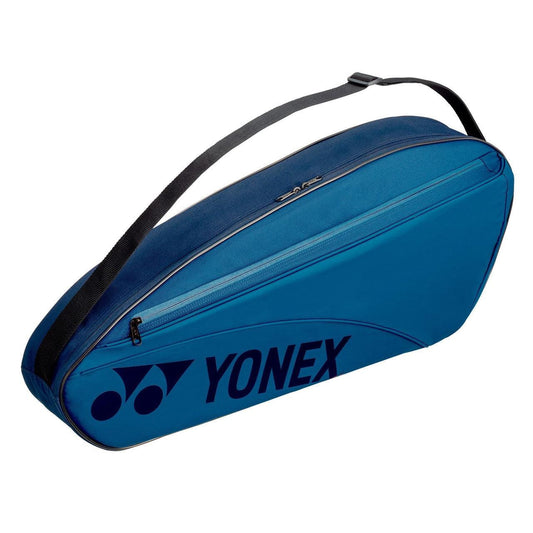 Introducing the Yonex 42323EX Team 3 Piece Racket Bag in Sky Blue, featuring a convenient zippered pocket and black shoulder strap—ideal for travelers who prefer to pack light.
