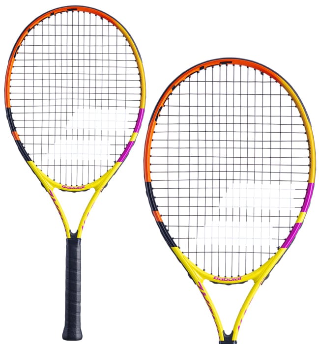 A pair of Babolat Nadal Junior 26 Tennis Rackets, showcasing vivid colors with yellow, orange, and purple accents. One racket is depicted in a side profile while the other one faces forward, highlighting its strings and grip, both carrying a sleek and modern design from the Babolat brand.