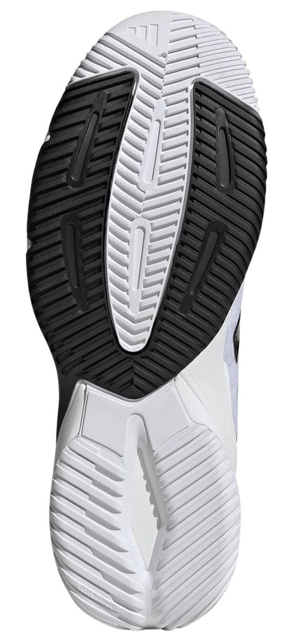 Close-up of the sole on adidas Crazyflight 6 Men's Indoor Tennis Shoes in white, featuring black and white rubber with textured grooves and geometric shapes for excellent grip—perfect for tennis.