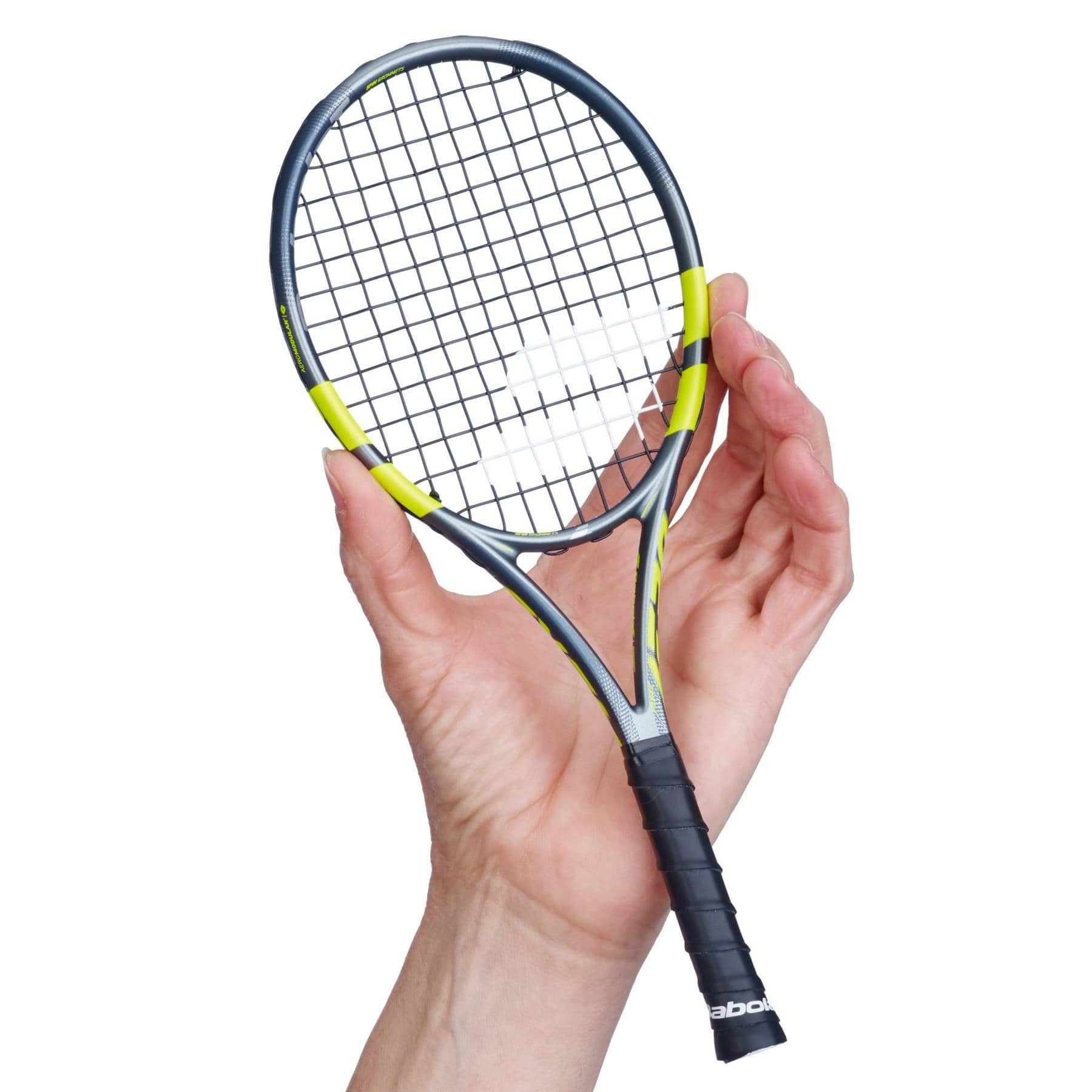 A hand holds a Babolat Mini Pure Aero 2026 Tennis Racket, featuring a black and yellow frame with a black grip, against a white background.
