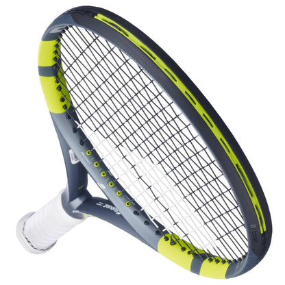 A close-up of the Babolat Pure Aero Lite 2026 Tennis Racket by Babolat showcases its lightweight, spin-friendly design with a white grip and black-and-yellow frame, angled upward against a white backdrop.