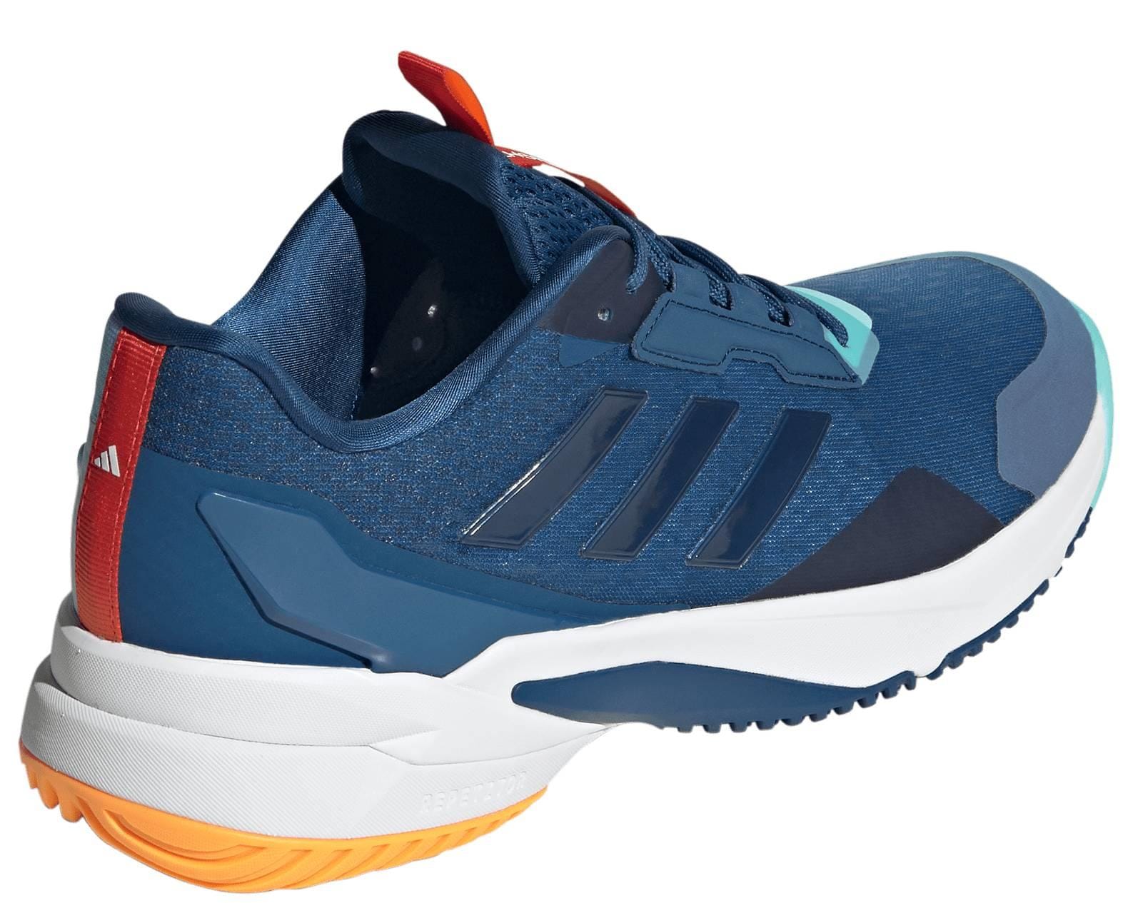 The adidas Crazyflight 6 Men’s Indoor Tennis Shoes in navy feature black stripes, a white midsole, orange heel and outsole accents, a light blue toe tip, and red pull tab—ideal for dynamic movement on the court.