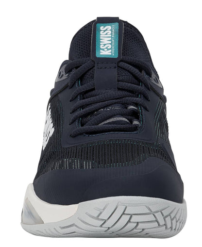 A front view of the K-Swiss Hypercourt Pinnacle Men's Tennis Shoe in Carbon/White/Baltic, showcasing black laces, a white "SWISS" label on the tongue, and a textured white sole with gray accents—expertly engineered for Hypercourt performance and enhanced by a carbon fibre plate for superior support.