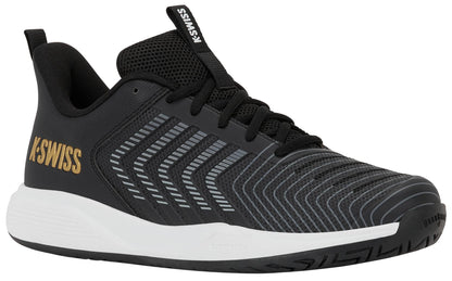The K-Swiss Ultrashot Light Men's Tennis Shoes in Moonless Night, White, and Gold feature a black mesh upper for breathability, a white sole, and gold K-Swiss branding on the heel. With gray striped accents along the side and a secure lace-up closure, these lightweight court shoes are ideal for tennis players who want both performance and style.