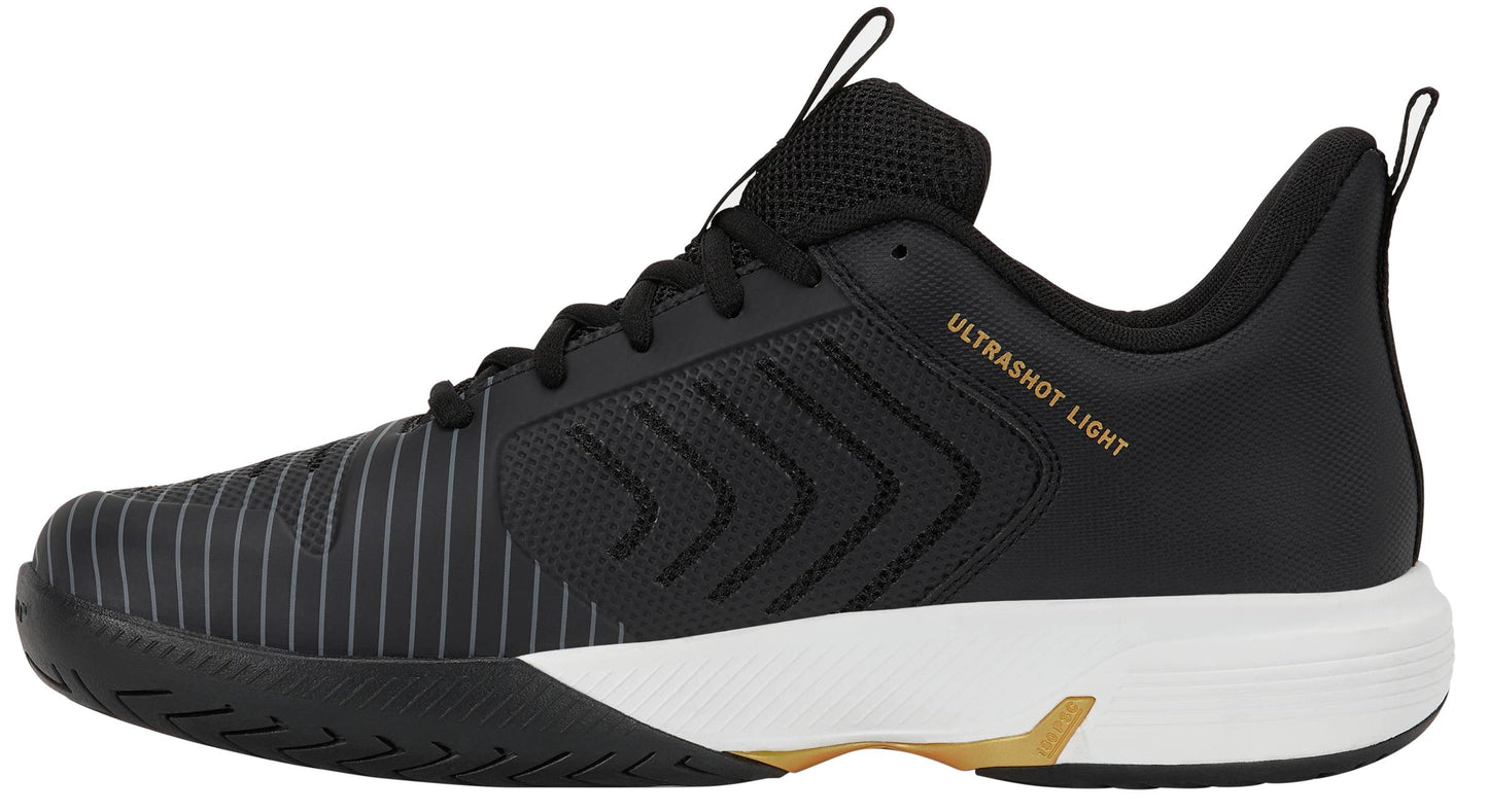 Introducing the K-Swiss Ultrashot Light Men’s Tennis Shoes in Moonless Night, White, and Gold. With a sleek black design complemented by a white sole and gold accents, these lightweight court shoes deliver optimal performance. The breathable mesh upper and bold striped detailing offer both style and support, making them an excellent choice for players searching for reliable and fashionable tennis footwear. "ULTRASHOT LIGHT" is prominently printed on the side as a mark of quality from K-Swiss.