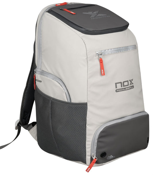 The NOX Supra Pickleball Backpack - Cream features side mesh pockets, red zipper pulls, the "NOX Pickleball" logo on the front, ergonomic padded straps for comfort, several compartments, and is made from NOX ThermoTech material.