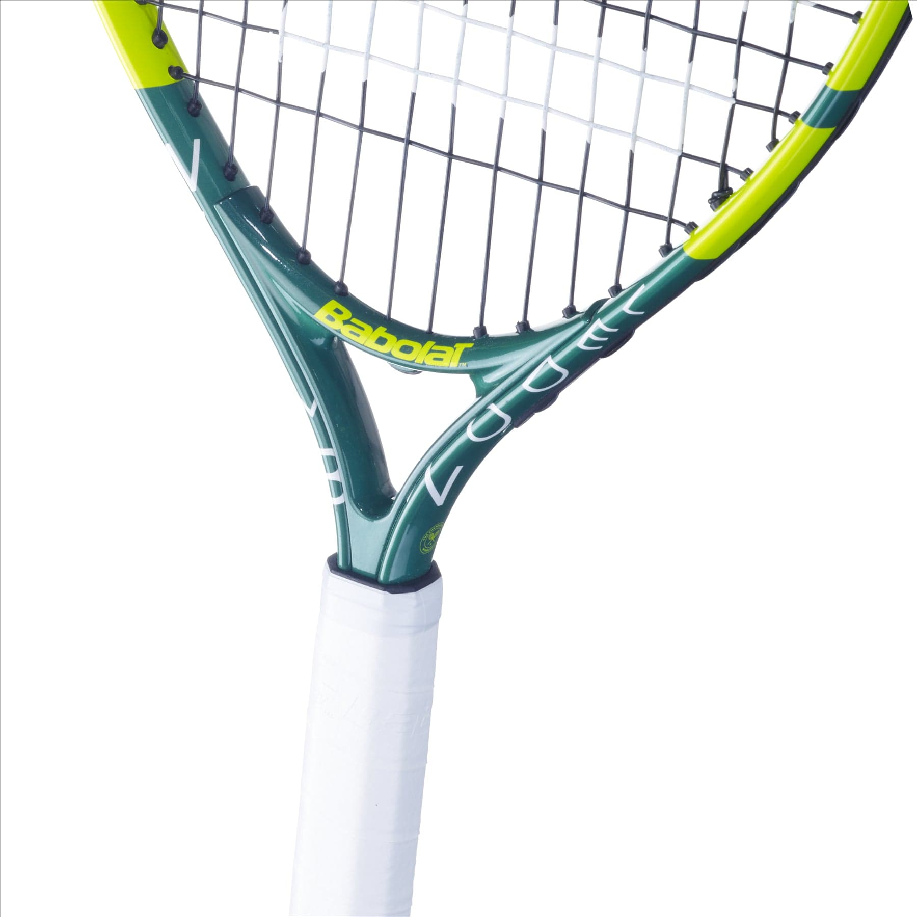 Close-up of the Babolat Wimbledon 21 Junior Tennis Racket. The frame is green with yellow accents, and the grip is wrapped in white. "Babolat" proudly adorns the neck of this aluminium racket, perfect for rising champions.