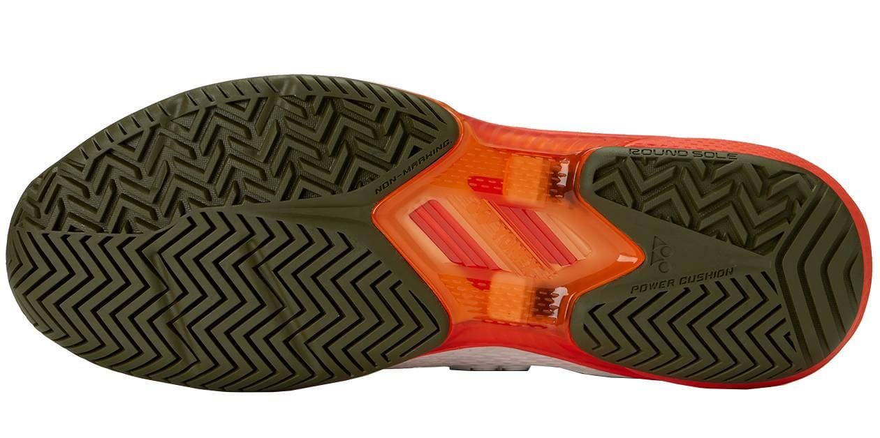 The image shows the sole of Yonex Power Cushion Ad-Accel Men's Tennis Shoes in white/orange, featuring a herringbone traction pattern and text reading "POWER CUSHION" and "BOUNCE SOLE" for speed on court.