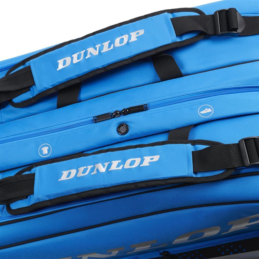 A close-up of the Dunlop FX Club 6 Racket Tennis Bag in black and blue showcases two handles with the Dunlop logo. This versatile bag is equipped with multiple zippers and compartments, making it ideal for storing rackets and carrying sports equipment.