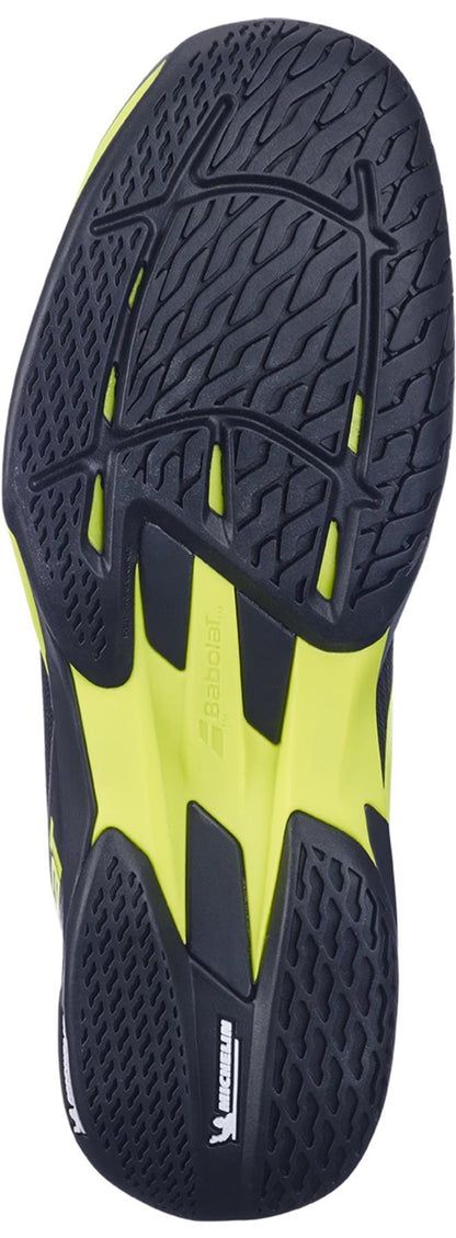 The image displays the sole of the Babolat Jet Mach 4 All Court Men's Tennis Shoe in Black/Aero, featuring black with yellow accents, detailed tread for agility, and visible Babolat and Michelin logos near the arch.