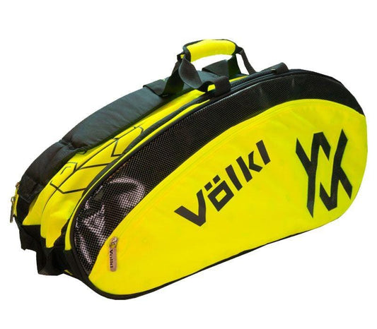 The Volkl Combi 6 Racket Tennis Bag in Black and Neon Yellow, featuring the Volkl logo on its side, includes a thermal climate-controlled lining. It offers a main compartment, additional pockets, short handles, and a shoulder strap for easy carrying.
