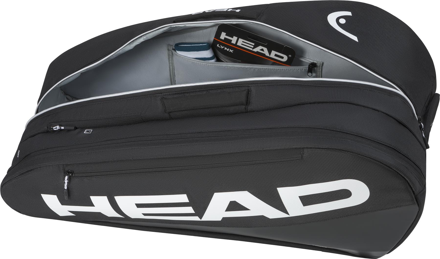 The HEAD Tour 9 Racket Tennis Bag L - Black by HEAD features a large white logo, spacious interior, and an inner pocket holding a tennis string package, shown unzipped for display.