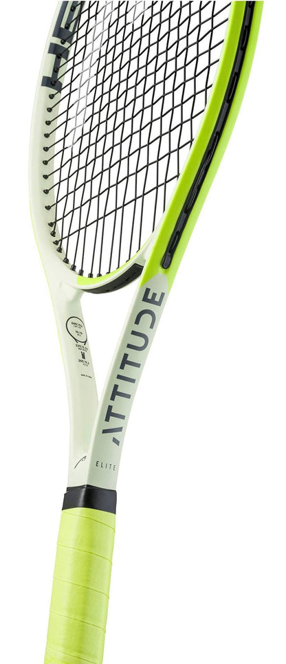 A close-up of the HEAD MX Attitude Elite Tennis Racket by HEAD highlights its lightweight design for beginners, yellow-green grip, and "ATTITUDE" printed on the frame, with visible strings.