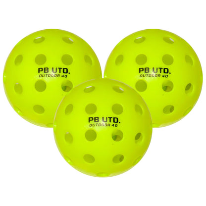 Three bright yellow balls labeled "PB UTD. OUTDOOR 40" are included in the Pickleball United All Round 2 Player Pickleball Set—perfect for outdoor games.