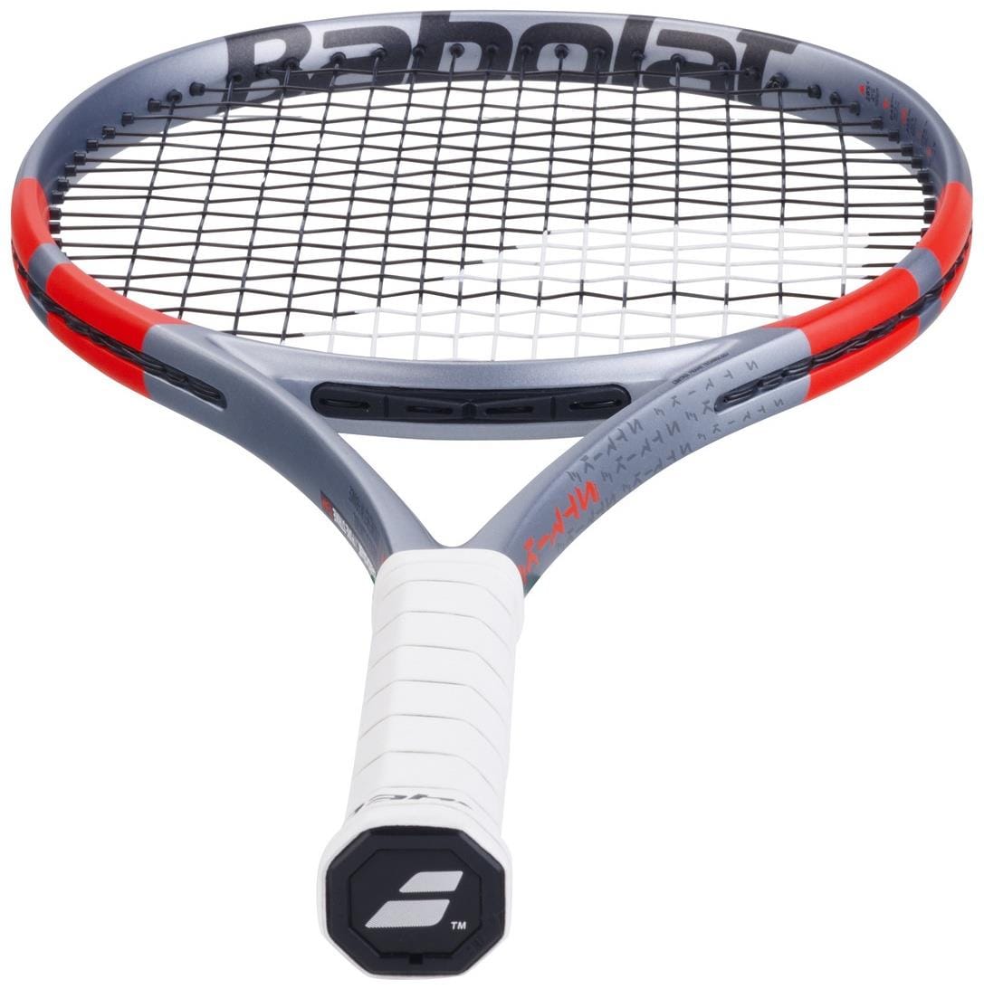 The Babolat Pure Strike Team Gen4 Tennis Racket in Carbon Grey, shown handle-forward with a white grip and black strings, delivers control and forgiveness for players on the court.