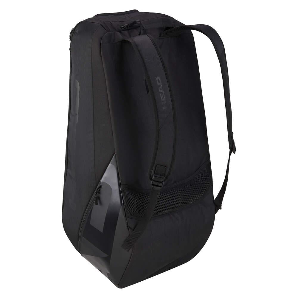 The HEAD Pro X Legend 9 Tennis Racket Bag L, in black, boasts a sleek and angular design inspired by Novak Djokovic. It includes adjustable shoulder straps, a zippered compartment, and mesh accents on the sides. Engineered with CCT+ climate control technology, this bag stands upright against a light gray background.