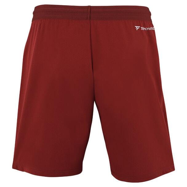 A pair of Tecnifibre Men's Team Tennis Shorts in Cardinal, featuring an elasticated waistband and the brand logo printed in white on the upper left side. These shorts have a plain design that offers excellent ventilation, ensuring optimal comfort during intense activities.