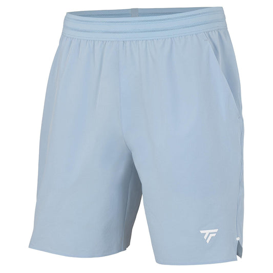The Tecnifibre Team Stretch Men's Tennis Shorts in Glacier Blue feature an elastic waistband, side pockets, and a white geometric logo on the lower left leg. Lightweight and comfortable, these shorts are ideal for sports or casual wear.