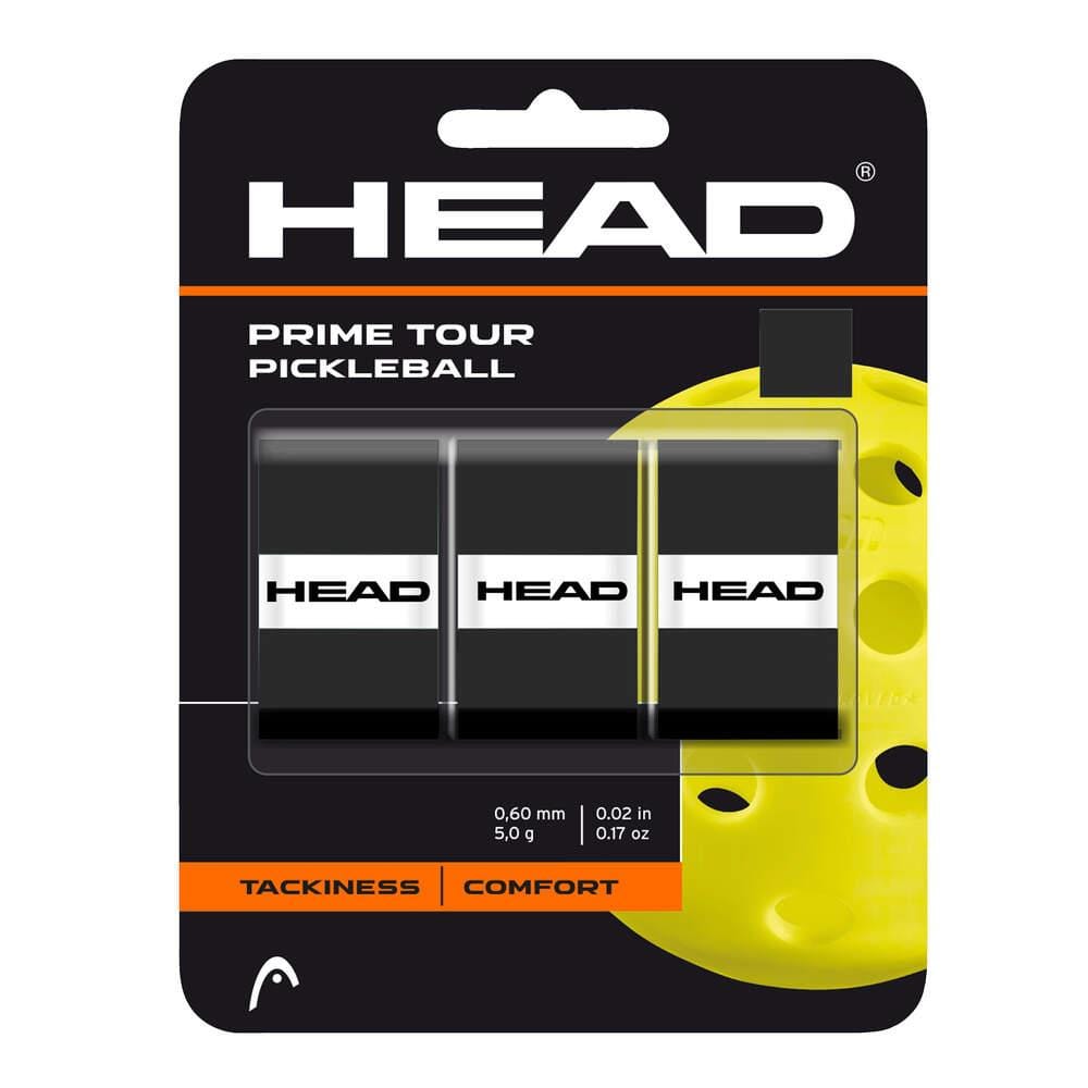 A 3-pack of HEAD Prime Tour Pickleball Overgrip in black, featuring white HEAD logos and packaging that highlights tackiness and superior comfort. Displayed before a large yellow pickleball image.