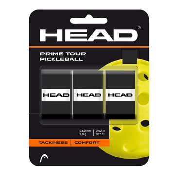 A 3-pack of HEAD Prime Tour Pickleball Overgrip in black, featuring white HEAD logos and packaging that highlights tackiness and superior comfort. Displayed before a large yellow pickleball image.