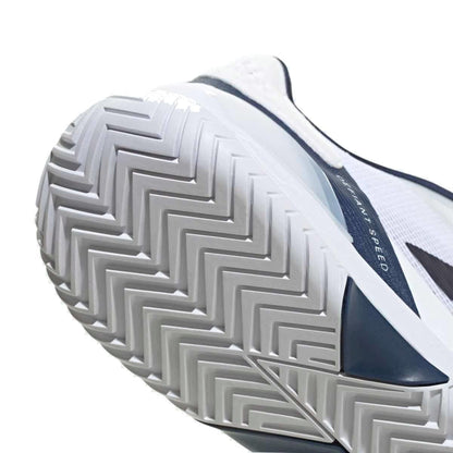 Close-up of the adidas Defiant Speed 2 Men's Tennis Shoes in White/Navy, showcasing the herringbone tread on the sole for traction and a dark side strip with partially visible text.