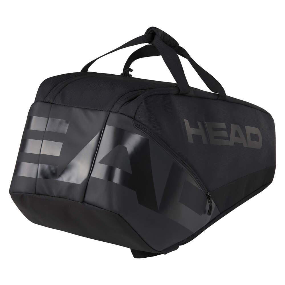The HEAD Pro X Legend 9 Tennis Racket Bag L in black showcases CCT+ climate control technology, boasts two carrying handles and a shoulder strap, and features the brand's name prominently on the side. Its contemporary angular design with visible zippers mirrors the style of Novak Djokovic.